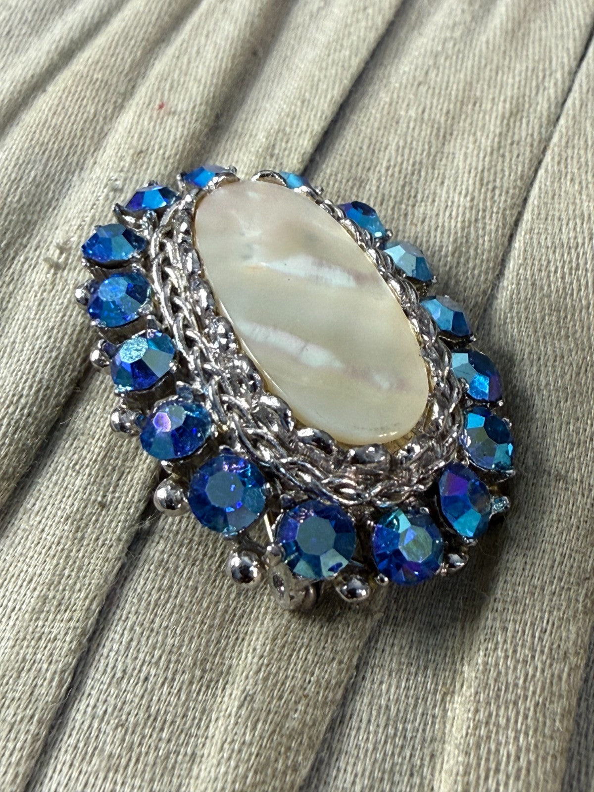 Vintage Sparkly Sphinx Brooch Pin Mother of Pearl Silver Tone Blue AB Rhinestone
