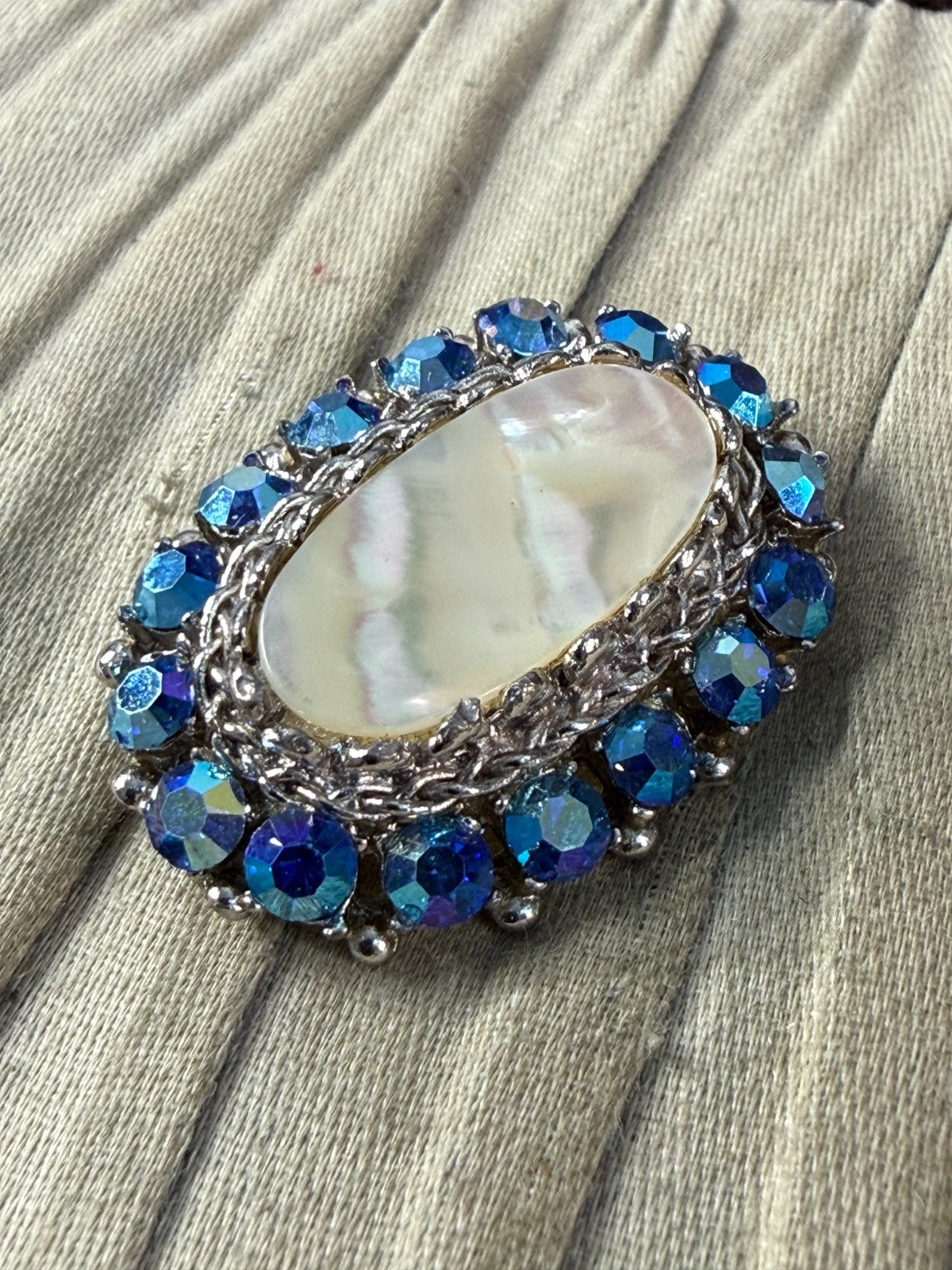 Vintage Sparkly Sphinx Brooch Pin Mother of Pearl Silver Tone Blue AB Rhinestone