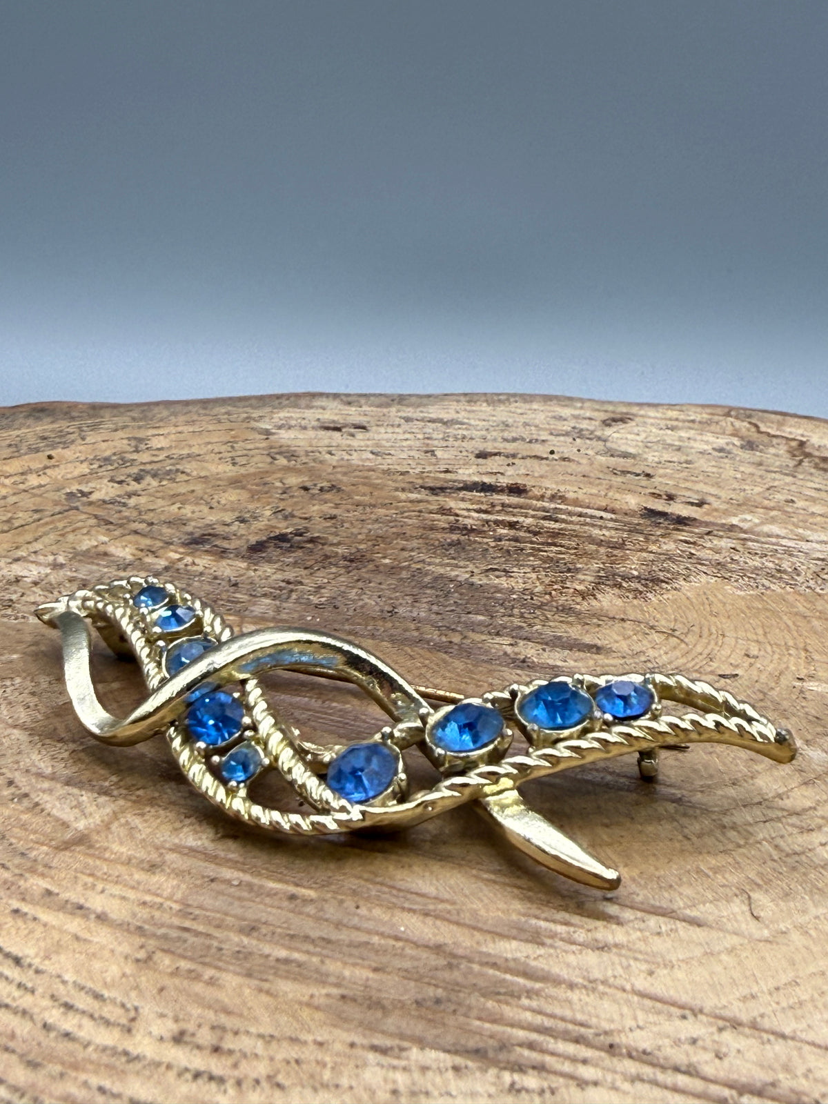 Vintage Ribbon Twist Brooch with Graduated Blue Rhinestones